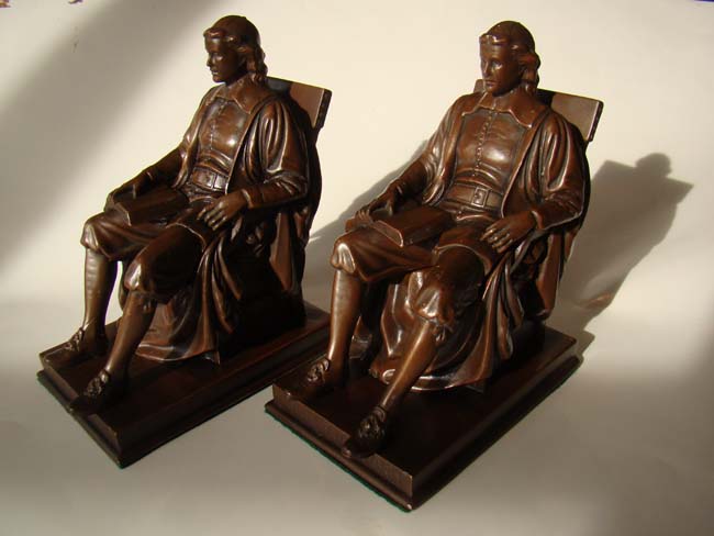 A lovely pair of chocolate bronze finished JOHN HARVARD bookends by Jennings Brothers circa 1920